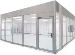 Modular cleanroom with glass walls and an entry door.
